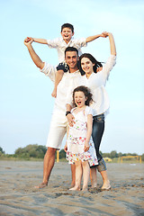 Image showing happy young family have fun on beach