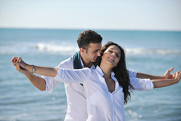 Image showing happy young couple have fun at beautiful beach