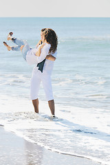 Image showing happy young couple have fun at beautiful beach