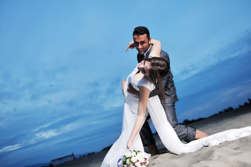 Image showing romantic beach wedding at sunset