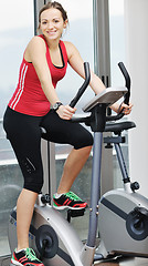 Image showing woman workout  in fitness club on running track 