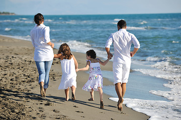 Image showing happy young  family have fun on beach