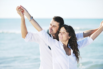 Image showing happy young couple have fun at beautiful beach