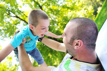 Image showing happy father and son have fun at park