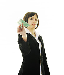 Image showing business woman throwing  paper airplane 