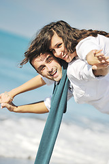 Image showing happy young couple have fun at beautiful beach