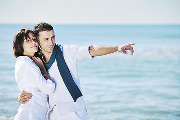 Image showing happy young couple have fun at beautiful beach