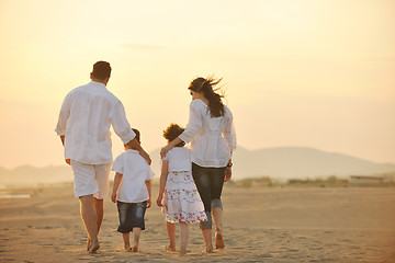 Image showing happy young family have fun on beach at sunset