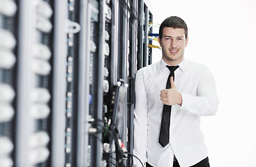 Image showing young it engeneer in datacenter server room