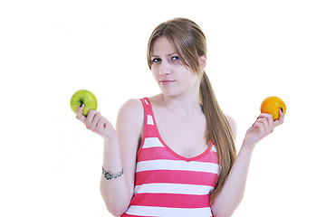 Image showing happy  young  woman eat apple isolated  on white