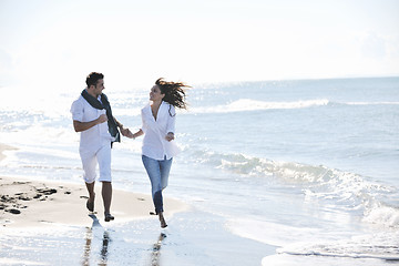 Image showing happy young couple have fun at beautiful beach