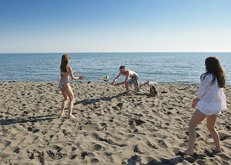 Image showing young people group have fun and play beach volleyball