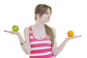 Image showing happy  young  woman eat apple isolated  on white