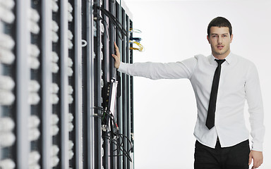 Image showing young it engeneer in datacenter server room