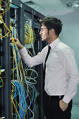 Image showing young it engineer in datacenter server room