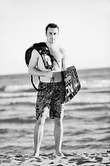 Image showing Portrait of a young  kitsurf  man at beach on sunset