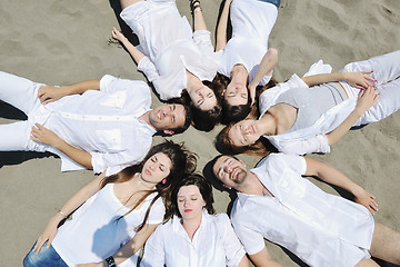 Image showing Group of happy young people in have fun at beach