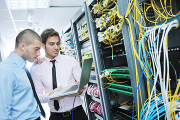 Image showing it enineers in network server room