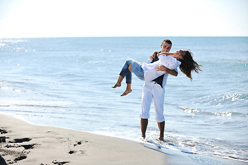 Image showing happy young couple have fun at beautiful beach