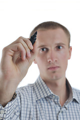 Image showing handsome young business man touching screen isolated