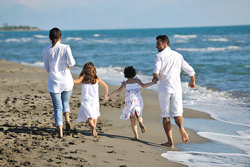 Image showing happy young  family have fun on beach