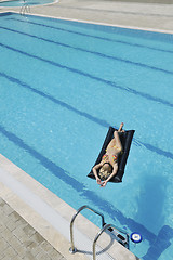 Image showing woman relax on swimming pool