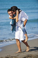 Image showing happy young couple have fun at beautiful beach