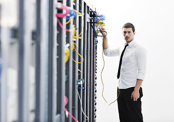 Image showing young it engeneer in datacenter server room