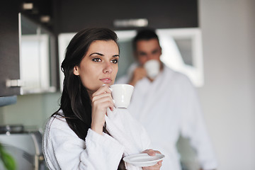 Image showing Young love couple taking fresh morning cup of coffee