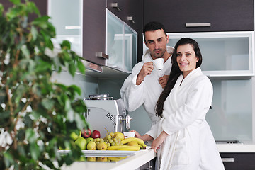 Image showing Young love couple taking fresh morning cup of coffee