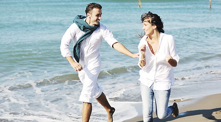 Image showing happy young couple have fun at beautiful beach