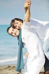 Image showing happy young couple have fun at beautiful beach