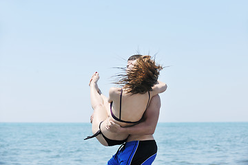 Image showing happy young couple have fun on beach