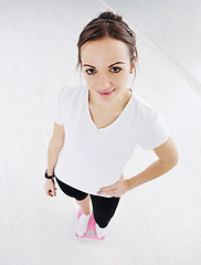 Image showing happy diet concept with young woman on pink scale