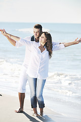 Image showing happy young couple have fun at beautiful beach