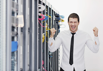 Image showing young it engeneer in datacenter server room