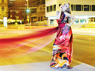 Image showing elegant woman on city street at night