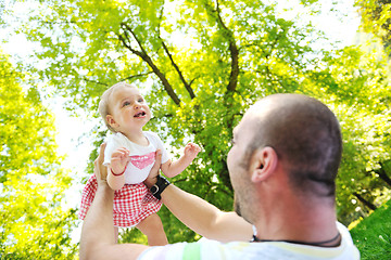 Image showing man and baby playing in park