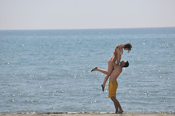 Image showing happy young couple have fun on beach