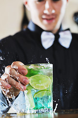 Image showing pro barman prepare coctail drink on party