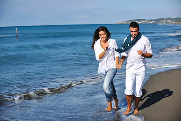 Image showing happy young couple have fun at beautiful beach