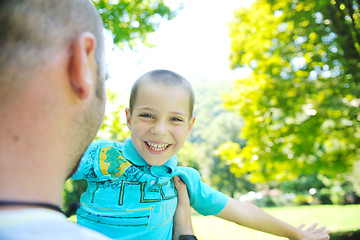 Image showing happy father and son have fun at park