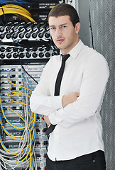 Image showing young it engeneer in datacenter server room