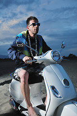 Image showing young man ride retro scooter