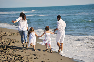 Image showing happy young  family have fun on beach