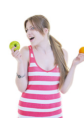 Image showing happy  young  woman eat apple isolated  on white