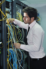 Image showing young it engineer in datacenter server room