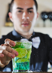 Image showing pro barman prepare coctail drink on party