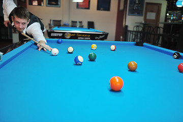 Image showing young man play pro billiard game 