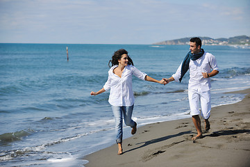 Image showing happy young couple have fun at beautiful beach